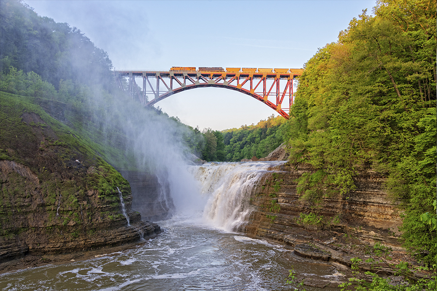 Train moving across Genesee Arch Bridge in Letchworth State Park