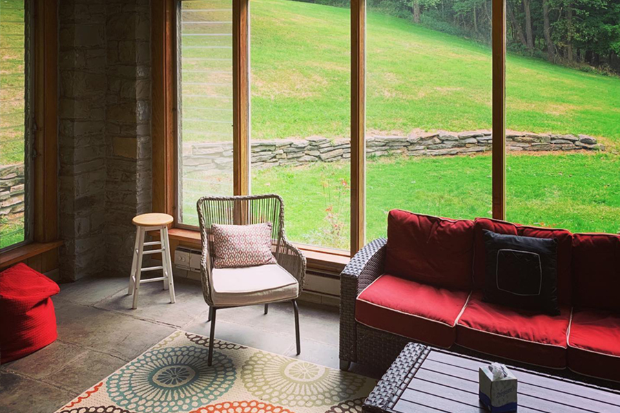 Furnished sunroom in the Stone House
